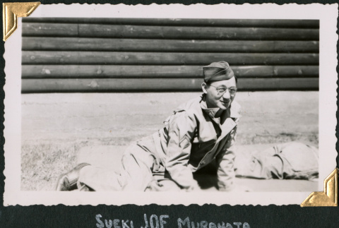 Man sitting on ground (ddr-densho-434-335)
