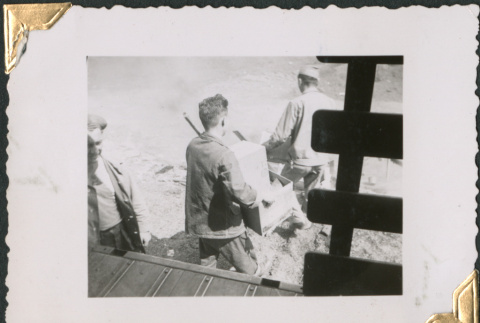 Men carrying boxes (ddr-densho-434-244)