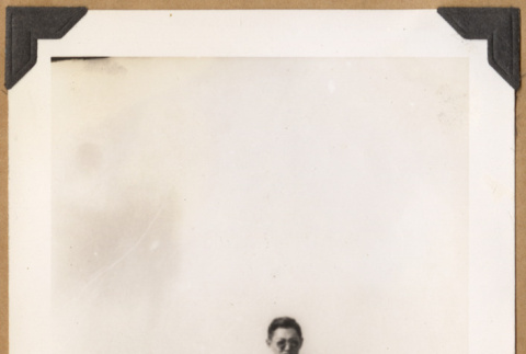 Man poses on a bridge (ddr-densho-542-135)