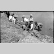 Some boys sit at the edge of a stony cliff (ddr-densho-480-20)