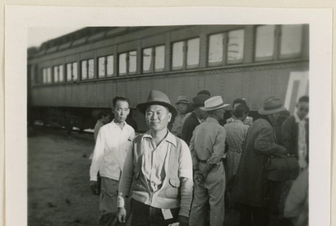 Man smiles at a train station (ddr-densho-37-920)