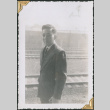 Man standing by railroad tracks (ddr-densho-434-286)