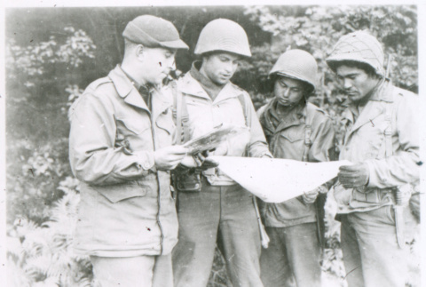 Four soldiers reading map (ddr-densho-1007-788)