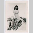 Woman on footbridge railing (ddr-densho-475-216)
