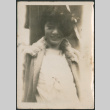 Woman leaning against wall (ddr-densho-523-8)