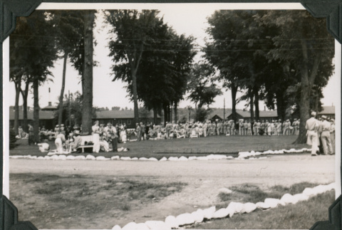 Large group standing in yard outside camp buildings (ddr-ajah-2-520)