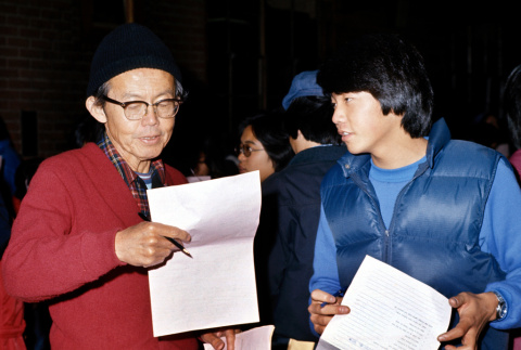 Rev. Iyoya and David Yamamura participating in icebreakers (ddr-densho-336-727)