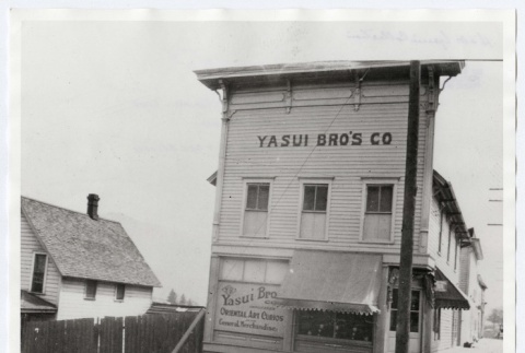 Yasui Bro's Store exterior on the corner of 1st and Oak Street (ddr-densho-259-658)