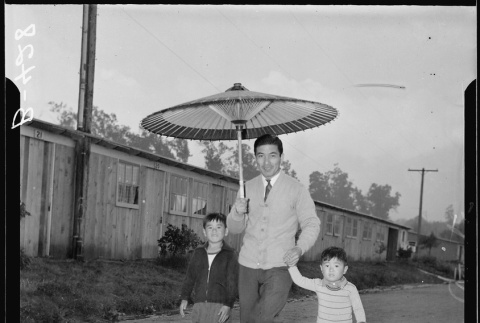 Japanese American with parasol (ddr-densho-37-766)