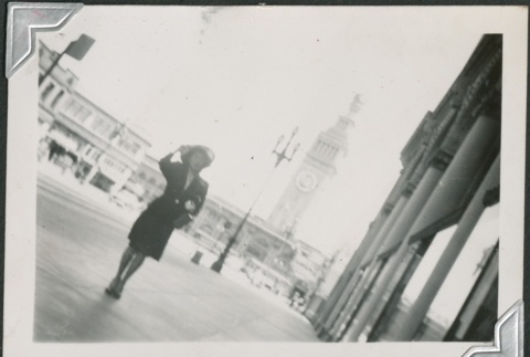 A woman walking down Market Street (ddr-densho-298-150)