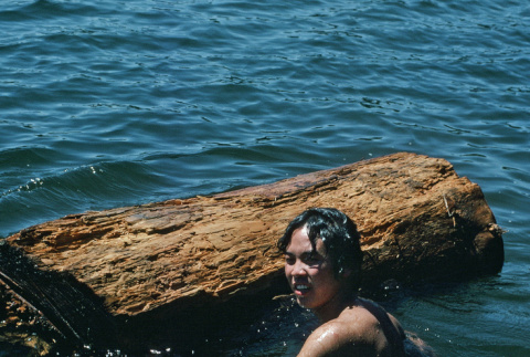 Roger Morimoto log rolling in the lake (ddr-densho-336-1131)