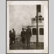 Two men standing by wheelhouse on ship (ddr-densho-466-79)