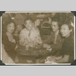 Joe Iwataki with two women and a man seated at nightclub (ddr-ajah-2-730)