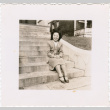 Suyeko Murakami sitting on steps (ddr-densho-467-3)
