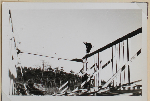 Construction worker atop a beam (ddr-densho-433-680)