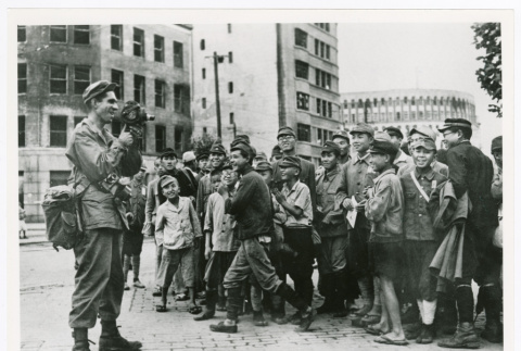Japanese schoolchildren and American Sgt. Charles Roman (ddr-densho-1007-243)