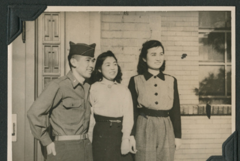 Nisei soldier poses with Japanese women (ddr-densho-397-293)