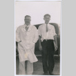 Two men in front of a car (ddr-densho-329-825)