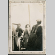 Three people by car (ddr-densho-316-231)