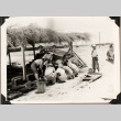Group working under thatch shelter (ddr-densho-587-90)
