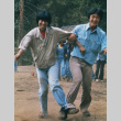 Steve Sawasaki and Ken Sasaki in a three-legged race (ddr-densho-336-843)