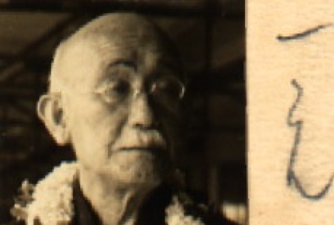 Law professor, Rokuichiro Masushim, wearing leis (ddr-njpa-4-790)