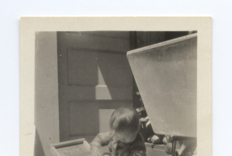 Baby playing with a washing board (ddr-one-6-3)