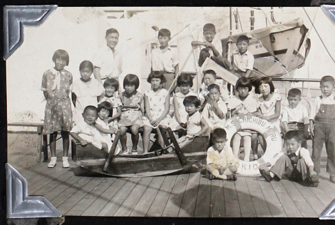 Children pose aboard the M.S. Chichibu Maru (ddr-densho-404-28)