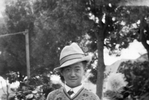 Tsutomu Inouye standing in garden (ddr-ajah-6-470)