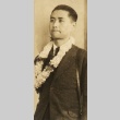Young man wearing leis (ddr-njpa-4-2101)