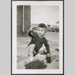 Photo of a child squatting (ddr-densho-483-766)