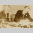Joseph P. Kennedy and another man working at a desk (ddr-njpa-1-778)