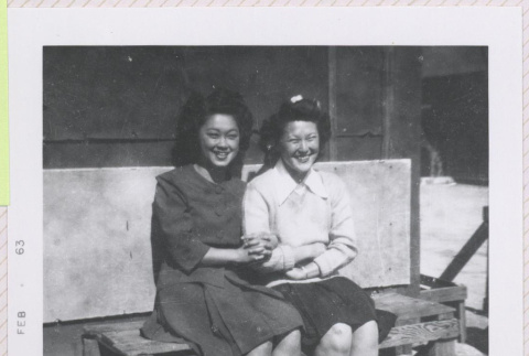 Two women sitting on a bench (ddr-manz-10-141)