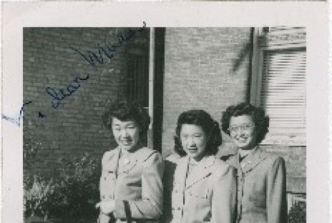 Three women posing in skirt suits (ddr-densho-201-438)