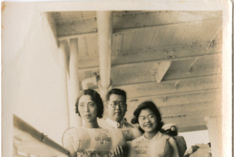 Tomoye (Nozawa) Takahashi with man and woman (ddr-densho-426-1531)