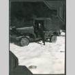 Man standing by truck (ddr-ajah-2-293)
