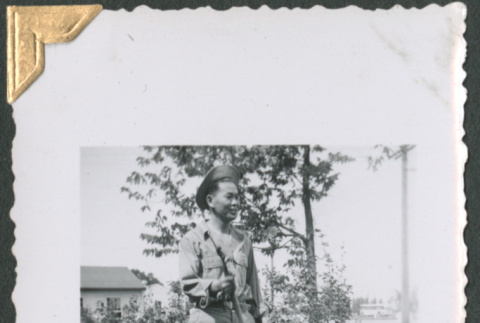 Man holding pole (ddr-densho-434-168)