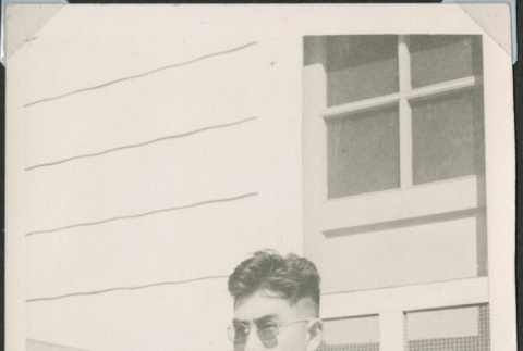 Man sitting on steps (ddr-densho-493-112)