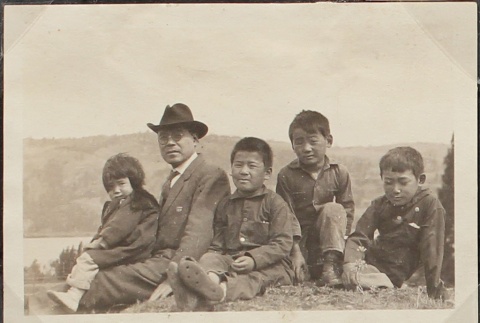 Father and children on a hillside (ddr-densho-259-71)