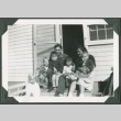 Adults with children sitting on front steps (ddr-densho-328-163)