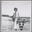 Nisei woman poses on board ship (ddr-densho-363-75)