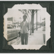 Man standing on a city street (ddr-densho-471-197)