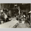 Photo of five individuals in a factory (ddr-densho-499-175)