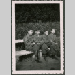 Four Soldiers sitting on bench (ddr-densho-368-564)