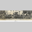 Panorama of large group of people posing outside building with banner: Y.M.B.A. Leave of North America (ddr-ajah-3-181)