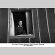 Woman looking out of barracks window (ddr-ajah-2-909)