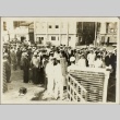 A crowd of naval officers and civilians standing in the street (ddr-njpa-13-1255)