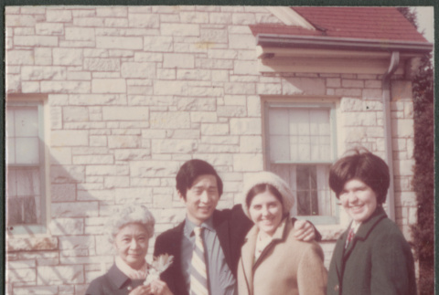 Agnes Sakura with man and two women outside house (ddr-densho-523-538)