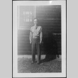 Man standing outside barracks (ddr-densho-434-426)