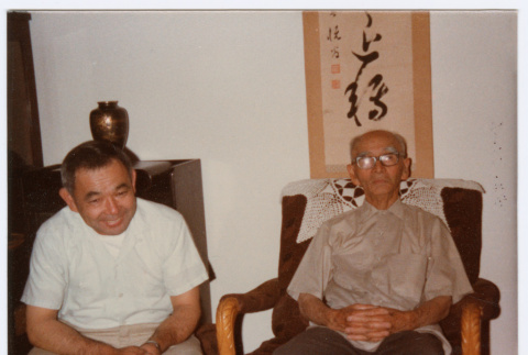 Two men sitting (ddr-densho-501-49)